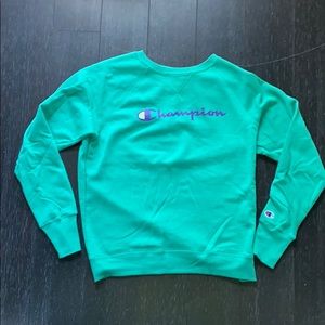 Woman’s green champion sweatshirt